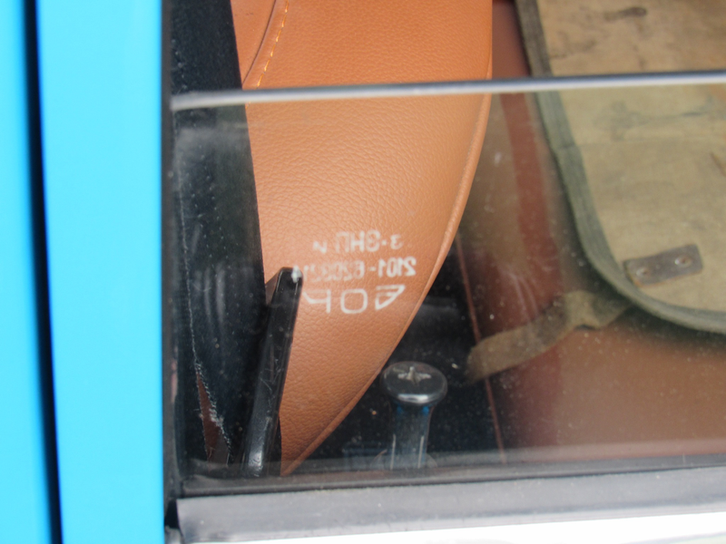 Cyrillic writing on the Lada’s rear window.